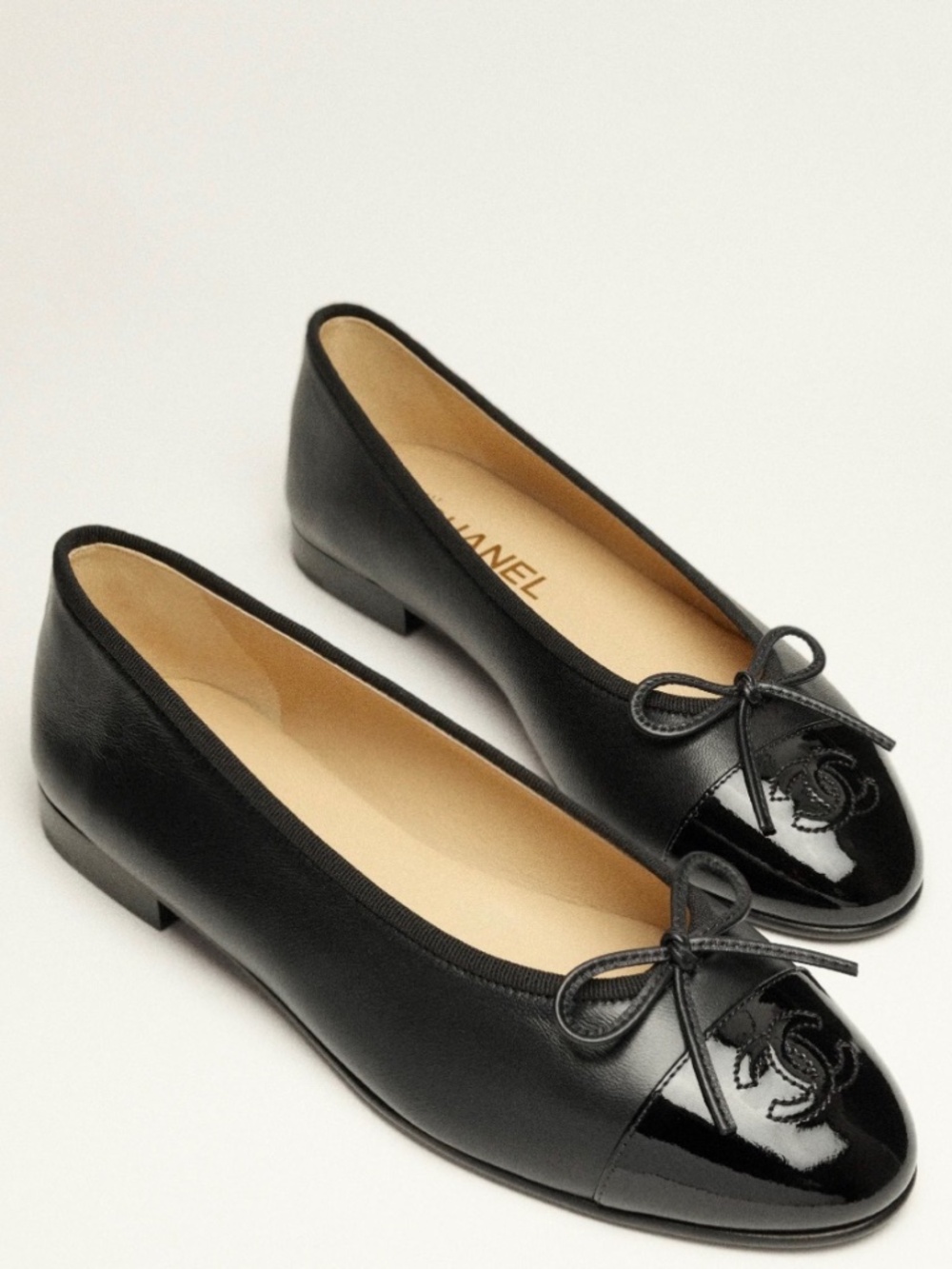 CHANEL Black Leather Patent Cap Toe Ballet Flats with CC Logo & Bow